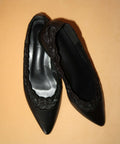 Black pointed-toe flats with lace details 