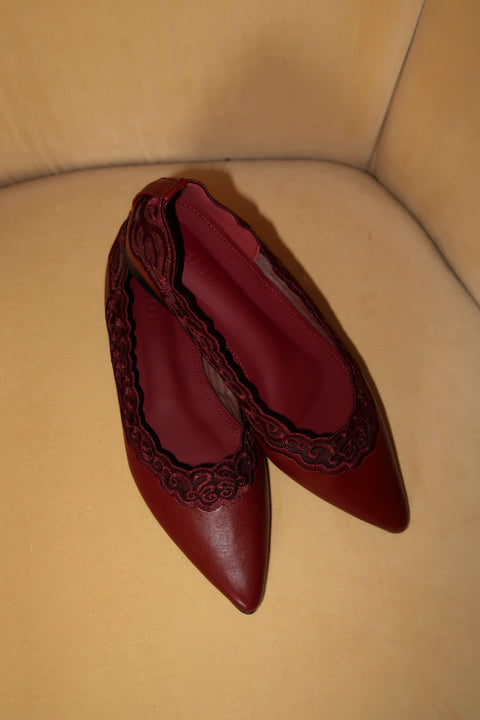 Pair of red wine flats with pointy 