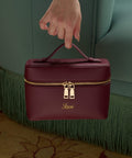 Maroon handbag with straps for crossbody style