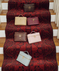 Five handbags in brown, beige, burgundy, light brown, pink and baby blue